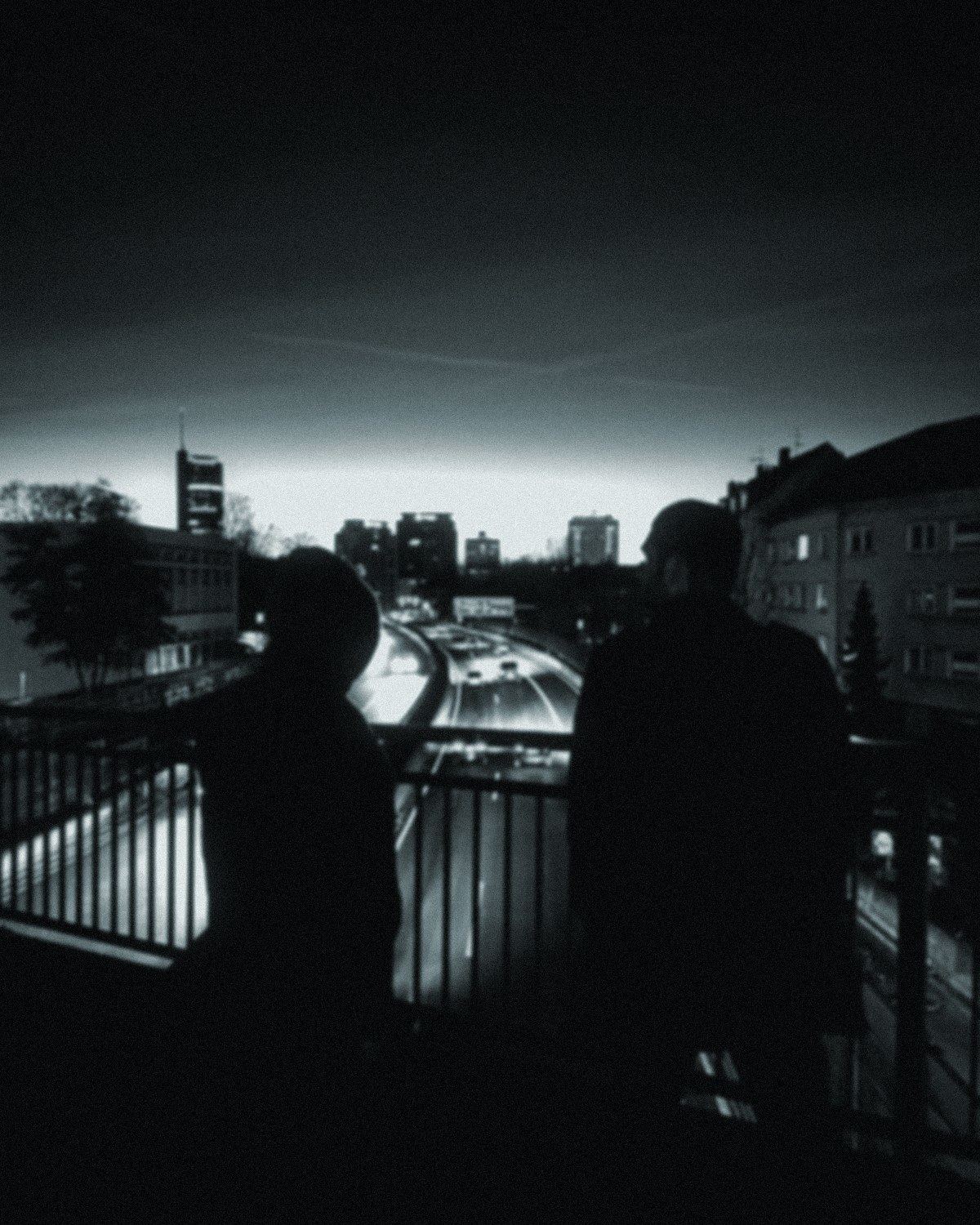 Daniel and Maik on a bridge over the A40 at night